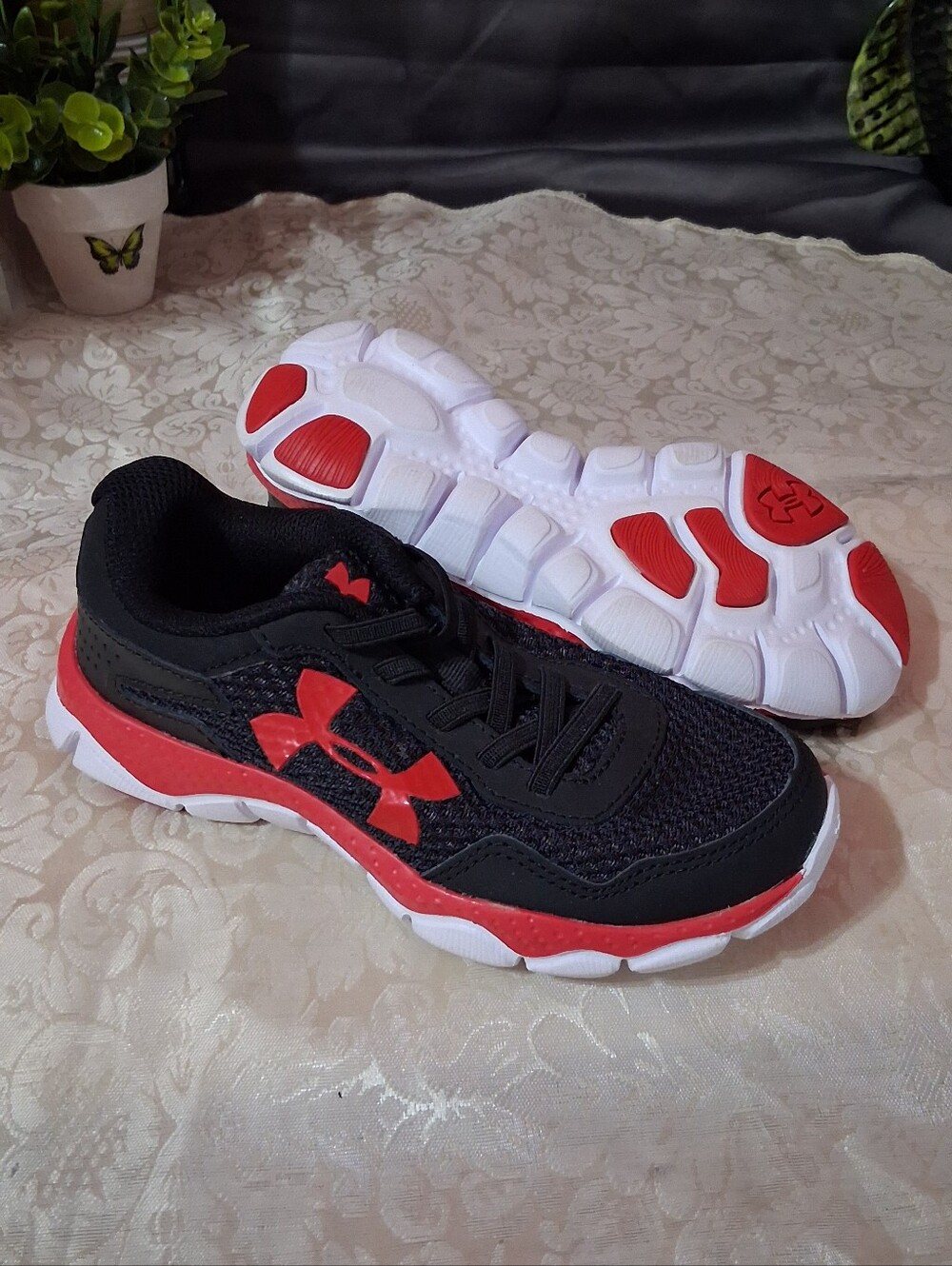 Under Armour Kids' Micro G Engage running shoe